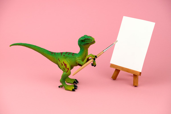 Dinosaure tenant un pinceau : illustre l'inspiration